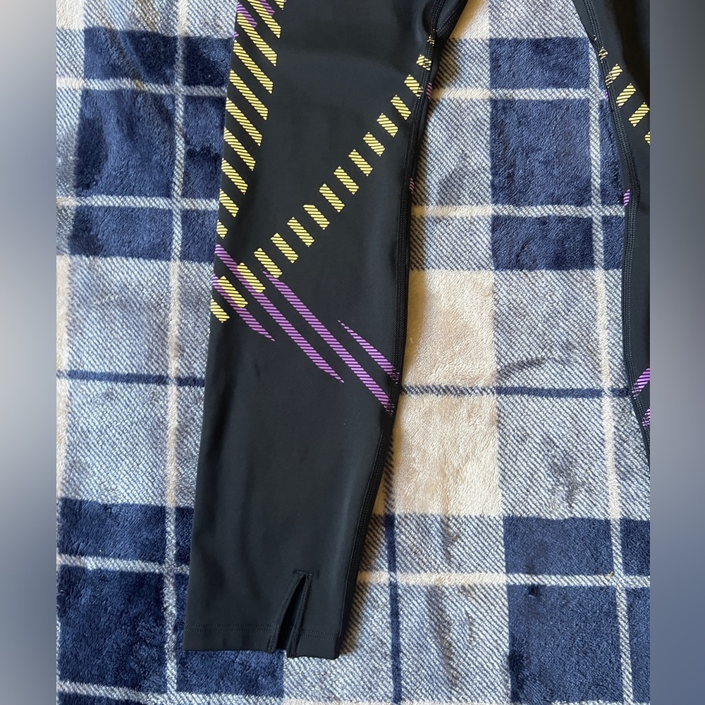 Nike Black Leggings with Purple and Yellow Diagonal Stripe Accents - Picture 10 of 10
